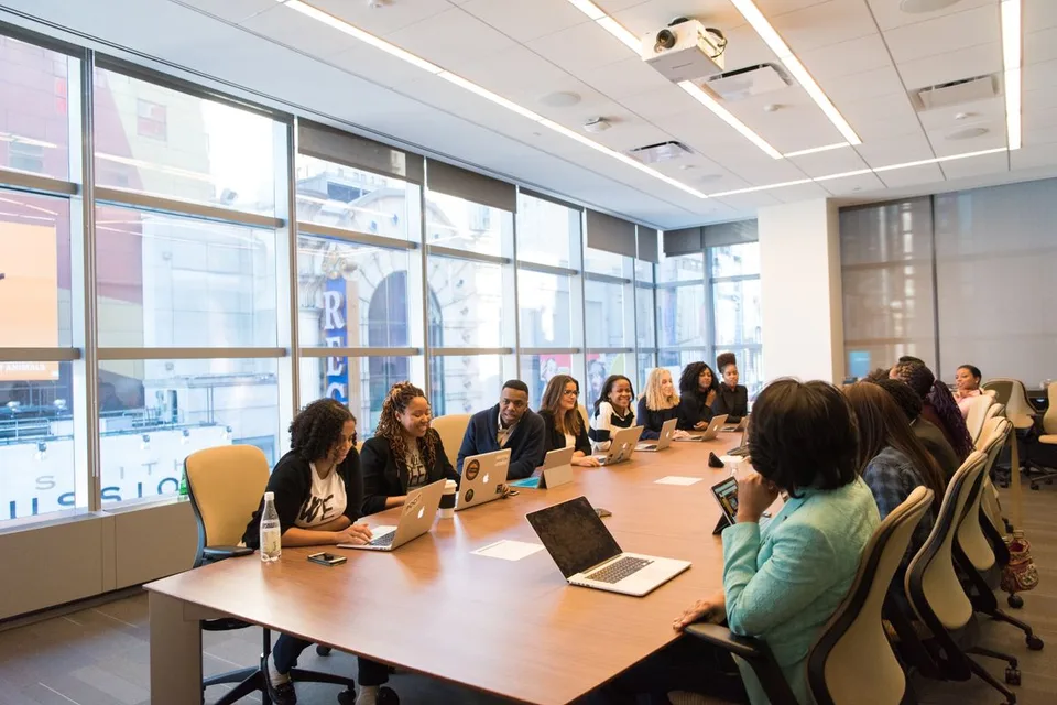 Participants at a conference table